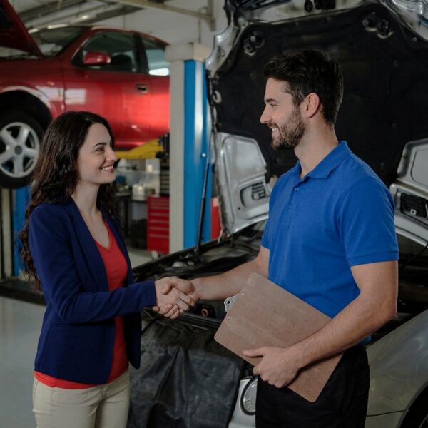 Auto Body Technicians speaking with customer-Muncie auto body repair