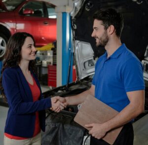 Auto Body Technicians speaking with customer-Muncie auto body repair