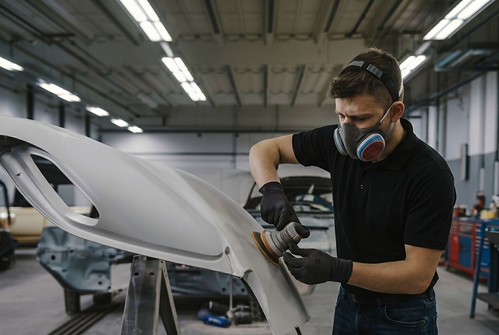 Technician sanding-Auto Collision Repair Lorens Body Shop Technician sanding-Auto Collision Repair Lorens Body Shop