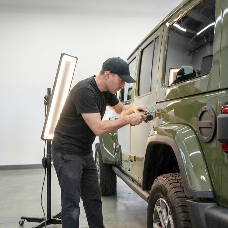 Green Jeep Wrangler getting PDR-Body Shop Bluffton Lorens Body Shop