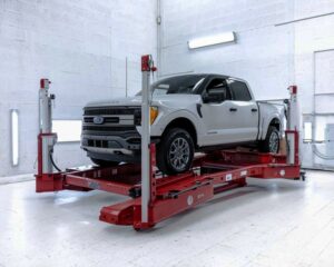 White truck on frame machine in body shop-Bluffton collision specialist
